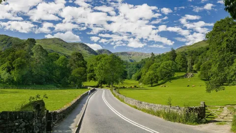 The A591 road as it passes through the countryside between Ambleside and Grasmere in the Lake District, England.